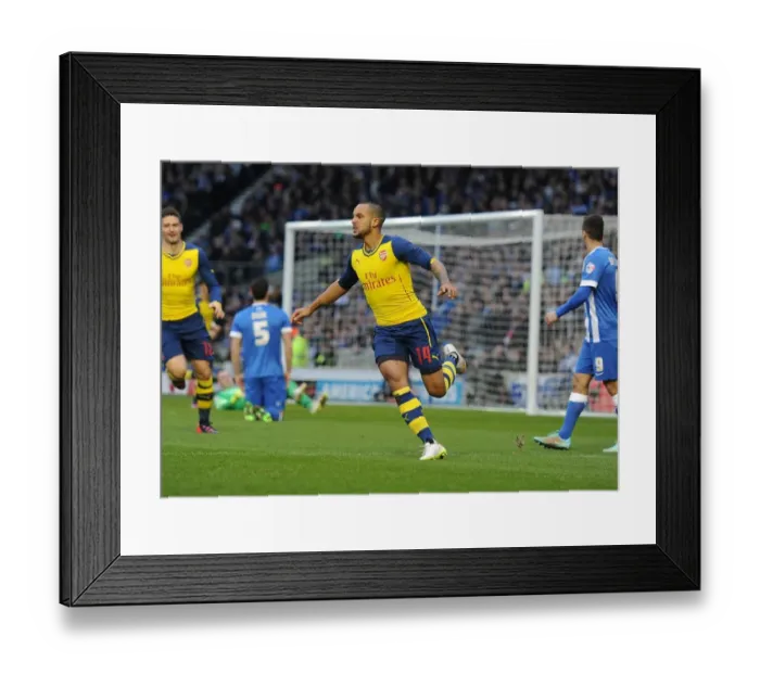 Framed Print : Theo Walcott's FA Cup Stunner: Arsenal's Euphoric Celebration at Brighton & Hove Albion