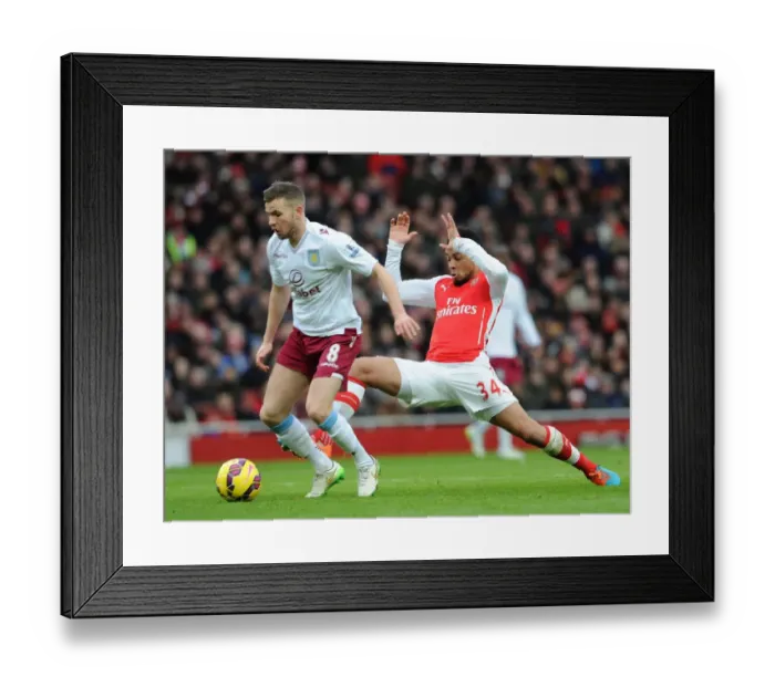 Framed Print : Francis Coquelin (Arsenal) Tom Cleverley (Villa). Arsenal 5: 0 Aston Villa. Barclays Premier League Framed Print : Francis Coquelin (Arsenal) Tom Cleverley (Villa). Arsenal 5: 0 Aston Villa. Barclays Premier League