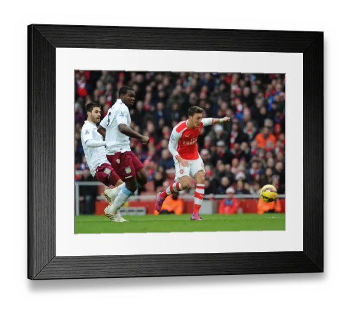Framed Print : Mesut Ozil scores Arsenals 2nd goal under pressure from Jores Okore and Carles Gil (Villa) Framed Print : Mesut Ozil scores Arsenals 2nd goal under pressure from Jores Okore and Carles Gil (Villa)