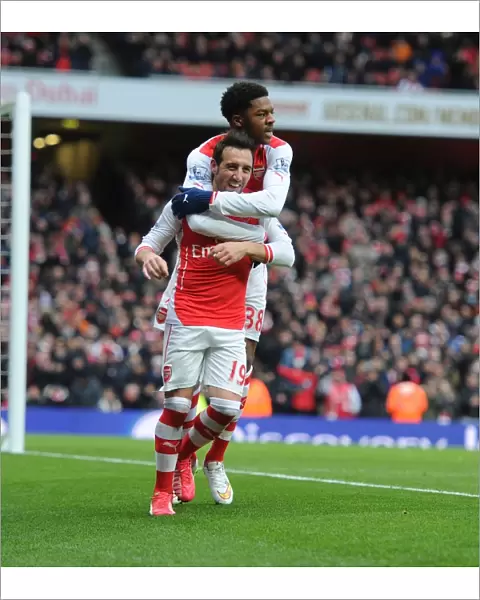 Santi Cazorla and Chuba Akpom Celebrate Arsenal's Fourth Goal Against Aston Villa (2015)