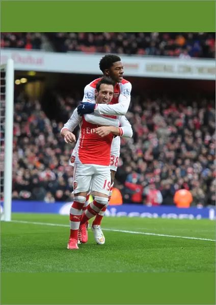Santi Cazorla and Chuba Akpom Celebrate Arsenal's Fourth Goal Against Aston Villa (2015)