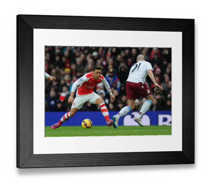 Framed Print : Mesut Ozil vs Alan Hutton: Clash at Emirates Stadium - Arsenal v Aston Villa, Premier League 2014-15