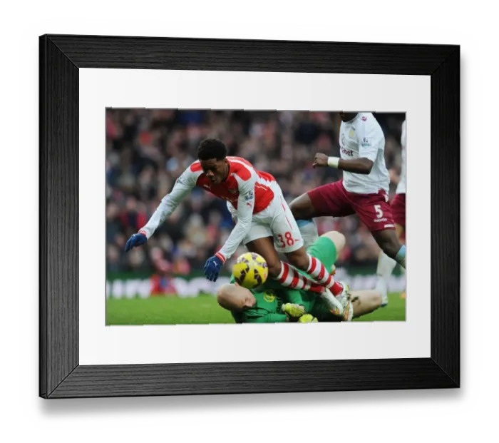 Framed Print : Arsenal vs Aston Villa: Akpom Wins Penalty in Premier League Clash