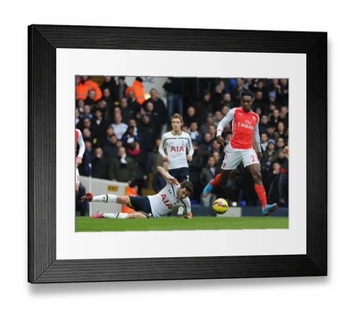 Framed Print : Dodging Danger: Welbeck Evasively Avoids Mason's Challenge in the Intense Arsenal vs. Tottenham Rivalry, Premier League 2014-15