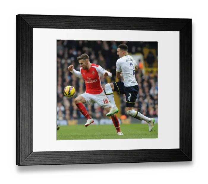 Framed Print : Intense Rivalry: Ramsey Foul in the Premier League Showdown between Arsenal and Tottenham (2014-15)