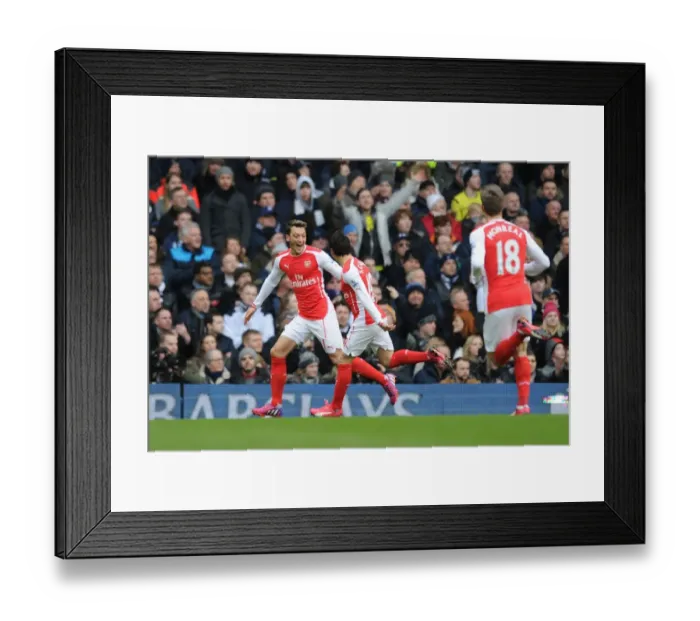 Framed Print : Arsenal's Ozil and Cazorla: Celebrating Glory Over Spurs in the 2015 Premier League