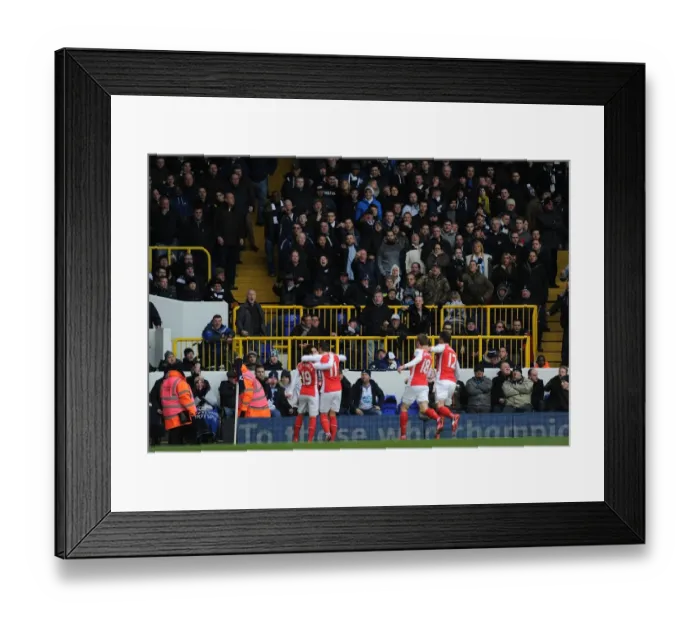 Framed Print : Arsenal Celebrate Mesut Ozil's Goal Against Tottenham Hotspur in the Premier League