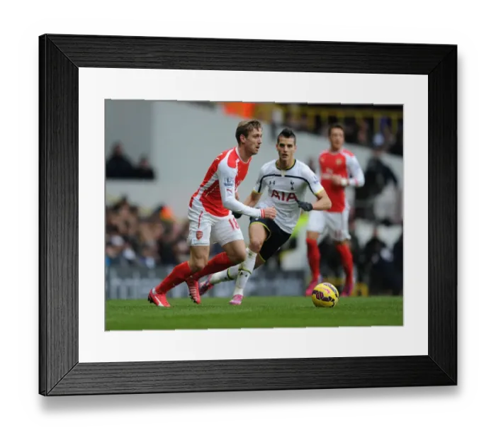 Framed Print : Nacho Monreal Outmaneuvers Erik Lamela: A Battle in the Premier League Clash Between Tottenham and Arsenal