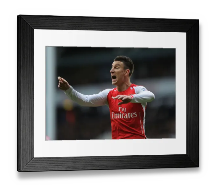 Framed Print : Laurent Koscielny Focused Amidst the Rivalry: Tottenham vs. Arsenal, Premier League 2014-15