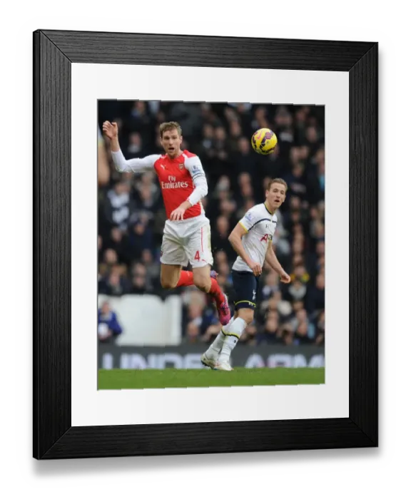Framed Print : Mertesacker Outjumps Kane: Arsenal vs. Tottenham, Premier League 2014-15 Framed Print : Mertesacker Outjumps Kane: Arsenal vs. Tottenham, Premier League 2014-15