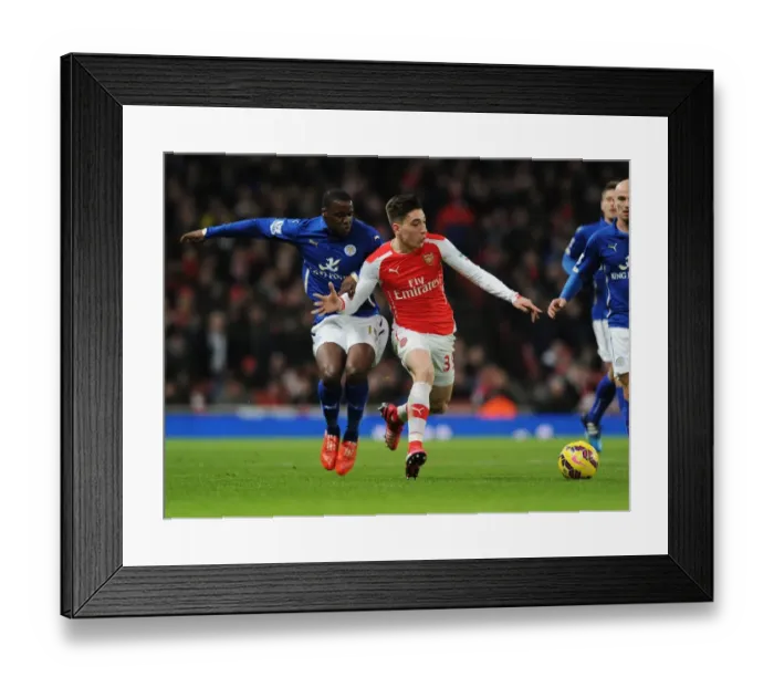 Framed Print : Arsenal's Bellerin Outruns Leicester's Schlupp in Premier League Clash Framed Print : Arsenal's Bellerin Outruns Leicester's Schlupp in Premier League Clash
