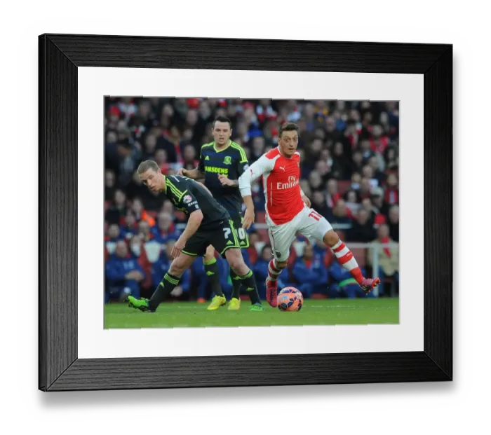 Framed Print : Mesut Ozil Outmaneuvers Grant Leadbitter in FA Cup Clash: Arsenal vs. Middlesbrough Framed Print : Mesut Ozil Outmaneuvers Grant Leadbitter in FA Cup Clash: Arsenal vs. Middlesbrough