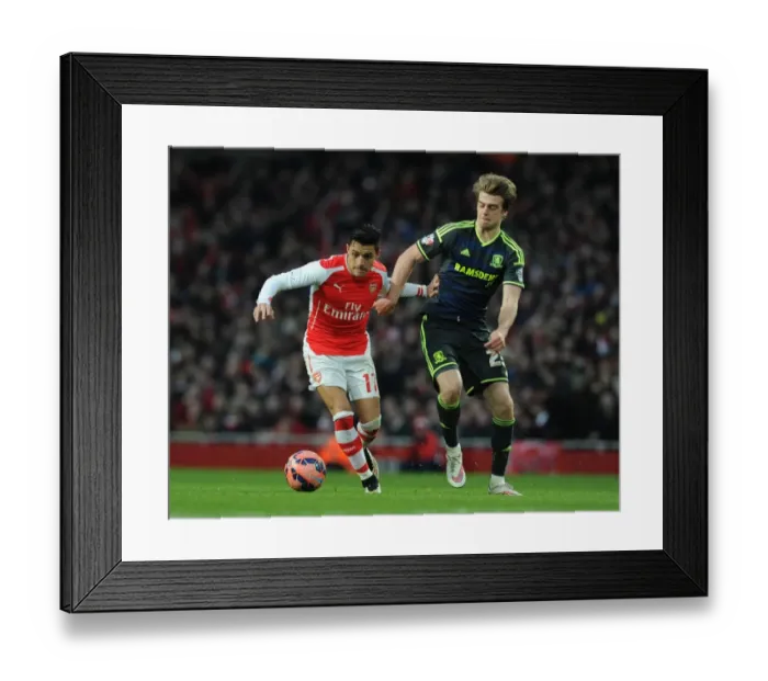 Framed Print : Arsenal's Alexis Sanchez Fends Off Middlesbrough's Patrick Bamford in FA Cup Clash