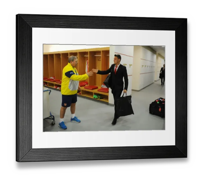 Framed Print : Arsenal FC: Mesut Ozil and Vic Akers in the Home Changing Room before FA Cup Match vs Middlesbrough