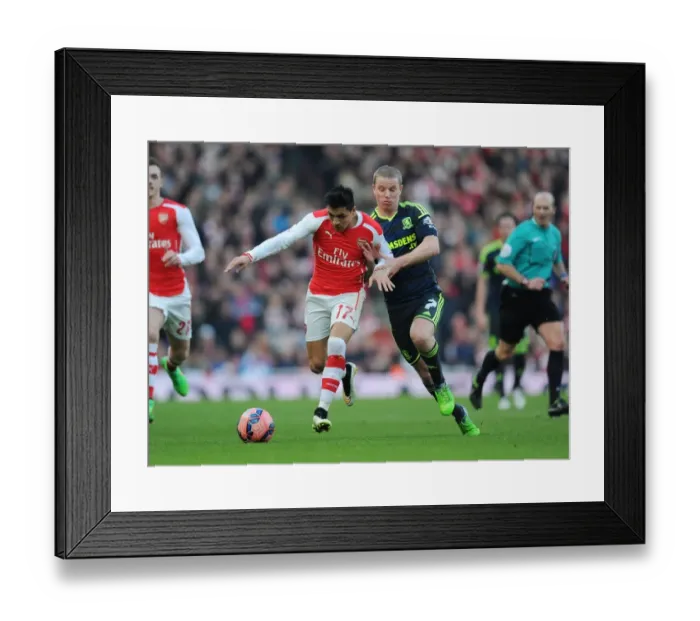 Framed Print : Arsenal's Alexis Sanchez vs. Middlesbrough's Grant Leadbitter: FA Cup Showdown Framed Print : Arsenal's Alexis Sanchez vs. Middlesbrough's Grant Leadbitter: FA Cup Showdown