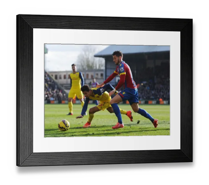 Framed Print : Arsenal's Alexis Sanchez Fends Off Crystal Palace's Joel Ward During Premier League Clash