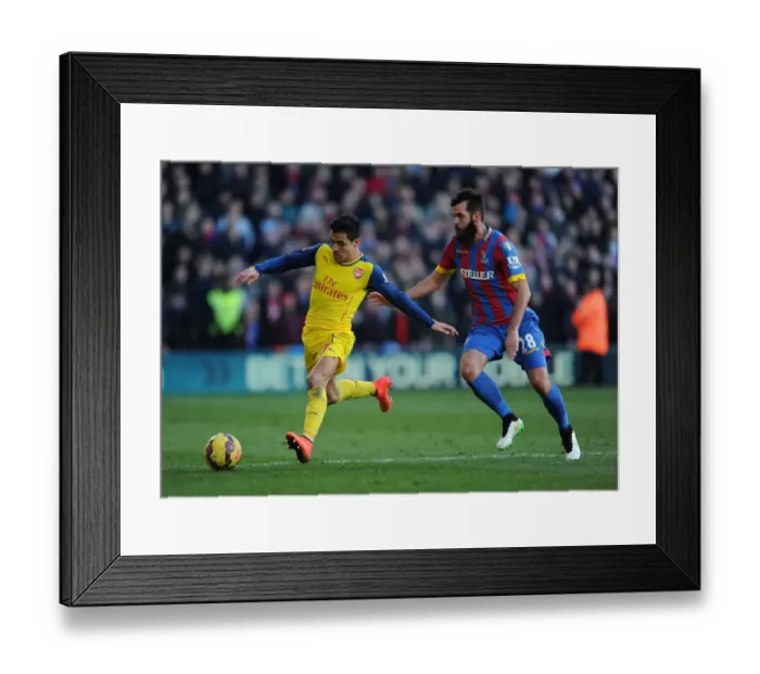 Framed Print : Alexis Sanchez Dashes Past Crystal Palace's Joe Ledley in Arsenal's Premier League Clash