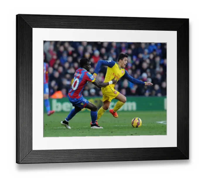 Framed Print : Clash of Champions: Sanchez vs. Souare in Premier League Battle