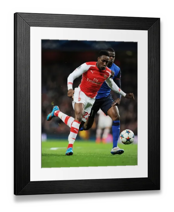Framed Print : Danny Welbeck's Brilliant Outmaneuver of Wallace: Arsenal's Thrilling Champions League Victory over Monaco (February 2015)