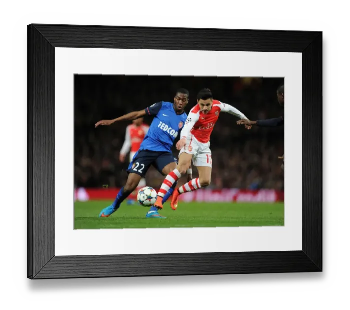 Framed Print : Arsenal's Alexis Sanchez vs Monaco's Geoffrey Kondogbia: A Champions League Battle Framed Print : Arsenal's Alexis Sanchez vs Monaco's Geoffrey Kondogbia: A Champions League Battle