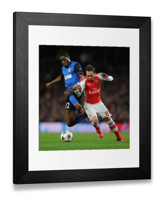 Framed Print : Clash of Midfield Titans: Cazorla vs Kondogbia in Arsenal's UEFA Champions League Battle against Monaco