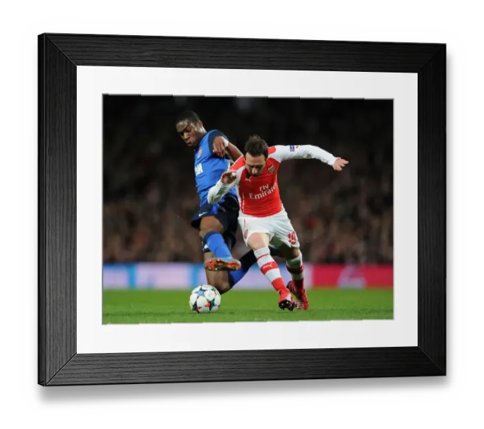 Framed Print : Clash of Midfield Maestros: Santi Cazorla vs. Geoffrey Kondogbia - Arsenal v AS Monaco, UEFA Champions League 2015