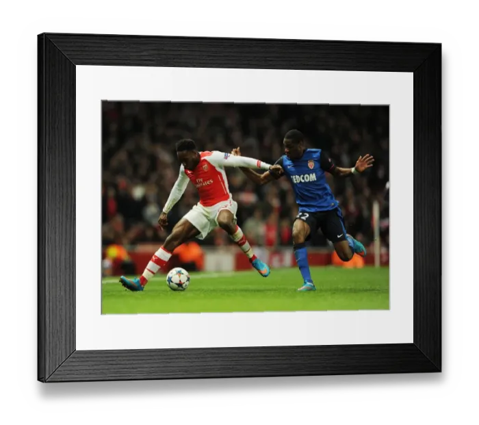 Framed Print : Arsenal's Danny Welbeck Outmaneuvers Monaco's Geoffrey Kondogbia in Champions League Showdown