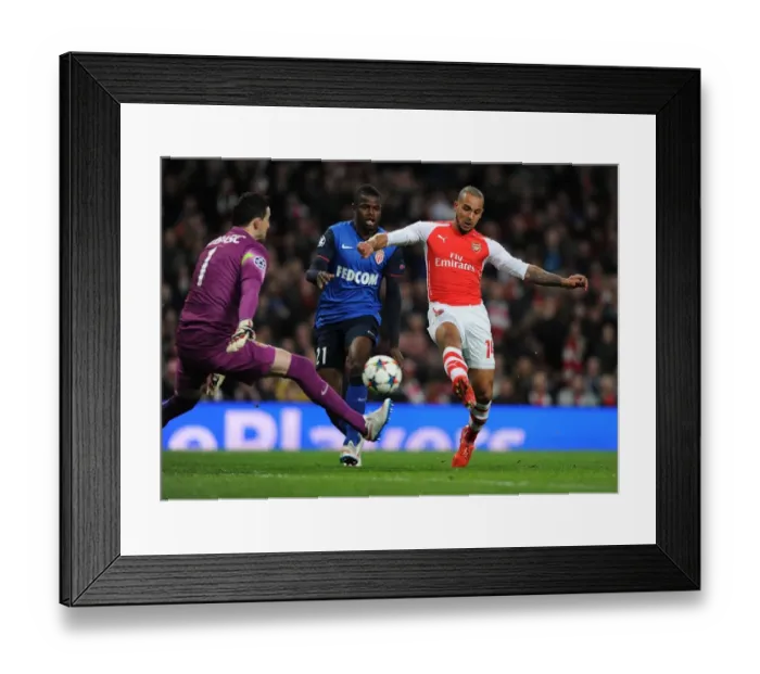 Framed Print : Clash at the Emirates: Walcott vs Monaco's Defense in UCL Showdown