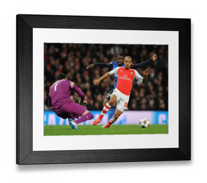 Framed Print : Theo Walcott vs. Danijel Subasic: Intense Battle in Arsenal v Monaco UEFA Champions League Clash Framed Print : Theo Walcott vs. Danijel Subasic: Intense Battle in Arsenal v Monaco UEFA Champions League Clash