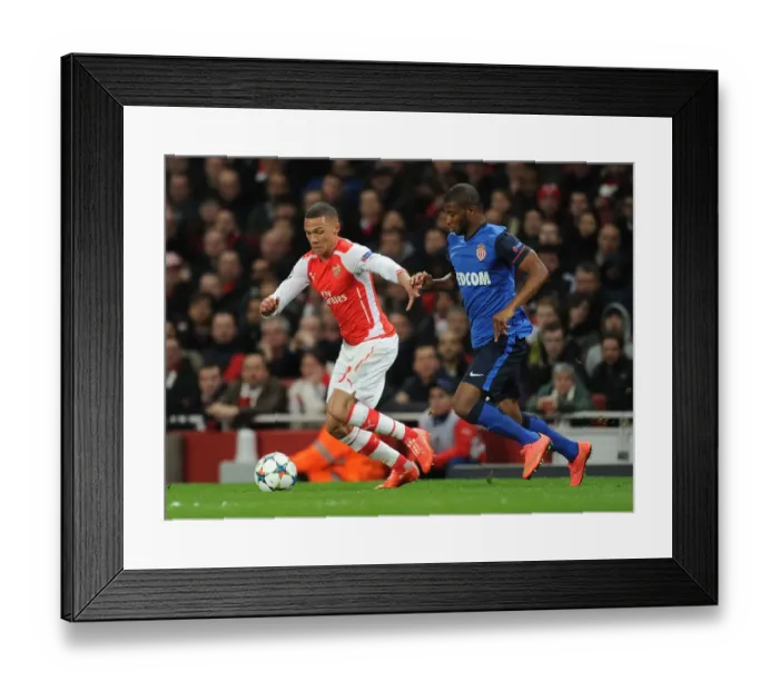 Framed Print : Arsenal's Kieran Gibbs Clashes with Monaco's Elderson in Champions League Showdown