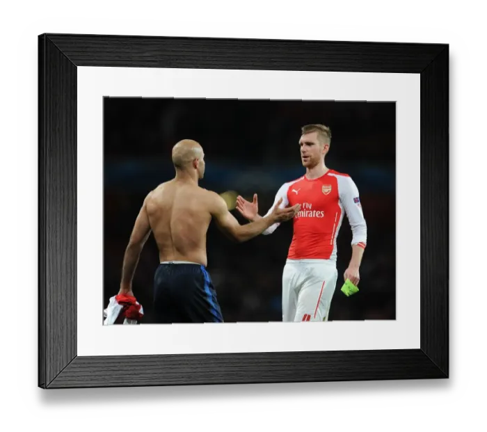 Framed Print : Arsenal's Per Mertesacker Shakes Hands with Monaco's Aymen Abdennour during Champions League Clash Framed Print : Arsenal's Per Mertesacker Shakes Hands with Monaco's Aymen Abdennour during Champions League Clash
