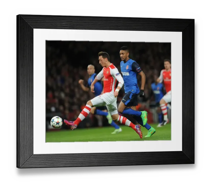 Framed Print : Mesut Ozil vs Wallace: Intense Battle in Arsenal's UEFA Champions League Clash Against AS Monaco Framed Print : Mesut Ozil vs Wallace: Intense Battle in Arsenal's UEFA Champions League Clash Against AS Monaco