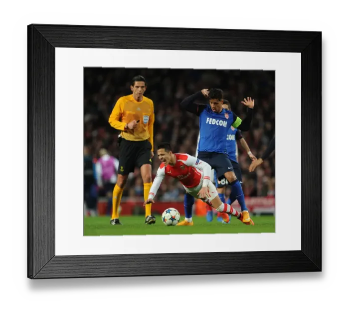 Framed Print : Arsenal's Alexis Sanchez Fouls by Monaco's Nabil Dirar in Champions League Clash Framed Print : Arsenal's Alexis Sanchez Fouls by Monaco's Nabil Dirar in Champions League Clash