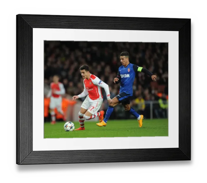 Framed Print : Alexis Sanchez (Arsenal) Nabil Dirar (Monaco). Arsenal 1: 3 AS Monaco. UEFA Champions League Framed Print : Alexis Sanchez (Arsenal) Nabil Dirar (Monaco). Arsenal 1: 3 AS Monaco. UEFA Champions League