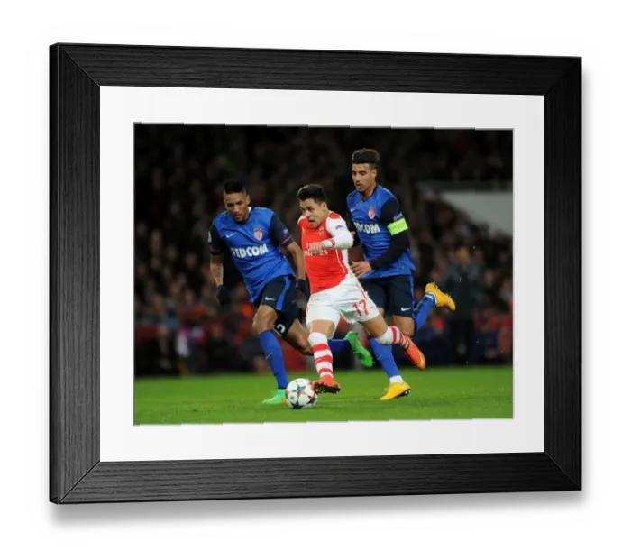 Framed Print : Clash of Stars: Sanchez vs. Dirar, Martial in Arsenal's UEFA Champions League Battle against Monaco