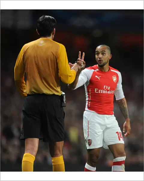 Theo Walcott Confronts Referee Deniz Aytekin during Arsenal vs. AS Monaco UEFA Champions League Match