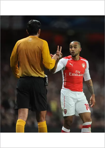 Theo Walcott Confronts Referee Deniz Aytekin during Arsenal vs. AS Monaco UEFA Champions League Match