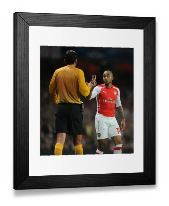 Framed Print : Theo Walcott Confronts Referee Deniz Aytekin during Arsenal vs. AS Monaco UEFA Champions League Match
