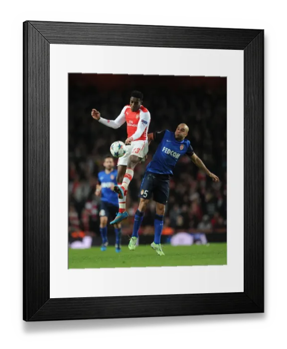 Framed Print : Clash of Champions: Welbeck vs Abdennour in Arsenal's Battle Against Monaco