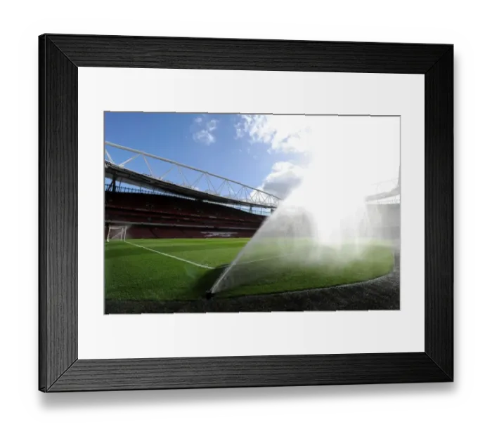 Framed Print : Emirates Stadium: Preparing the Wet Pitch for Arsenal vs. Everton (2014-15)