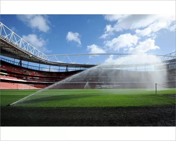 Emirates Stadium pitch is watered before the match. Arsenal 2: 0 Everton. Barclays Premier League