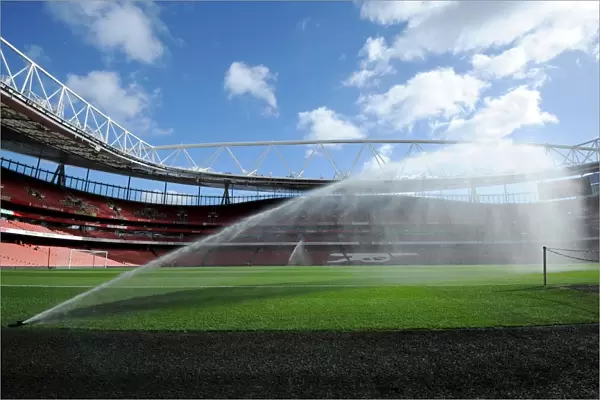 Emirates Stadium pitch is watered before the match. Arsenal 2: 0 Everton. Barclays Premier League