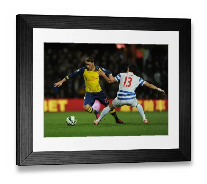 Framed Print : Mesut Ozil vs. Suk-Young Yun: Clash at Loftus Road