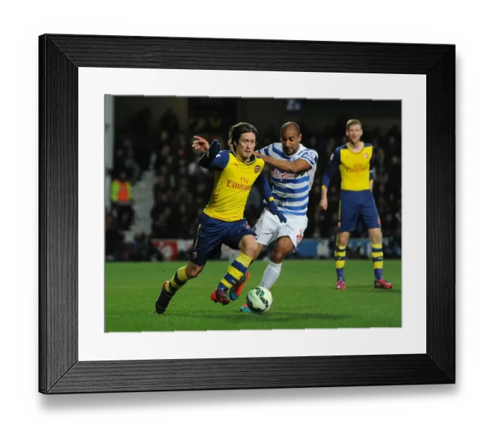 Framed Print : Rosicky vs. Henry: Intense Battle in Queens Park Rangers vs. Arsenal Premier League Clash