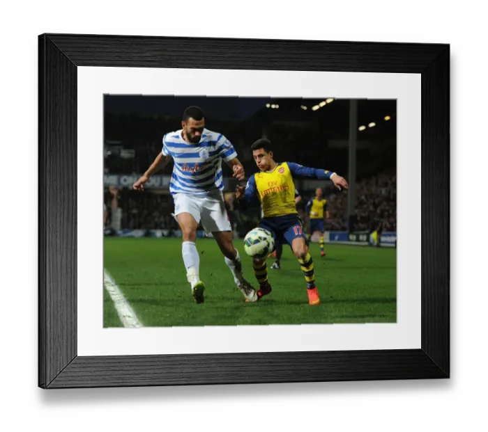 Framed Print : Arsenal's Alexis Sanchez Faces Off Against QPR's Steve Caulker in Premier League Clash Framed Print : Arsenal's Alexis Sanchez Faces Off Against QPR's Steve Caulker in Premier League Clash