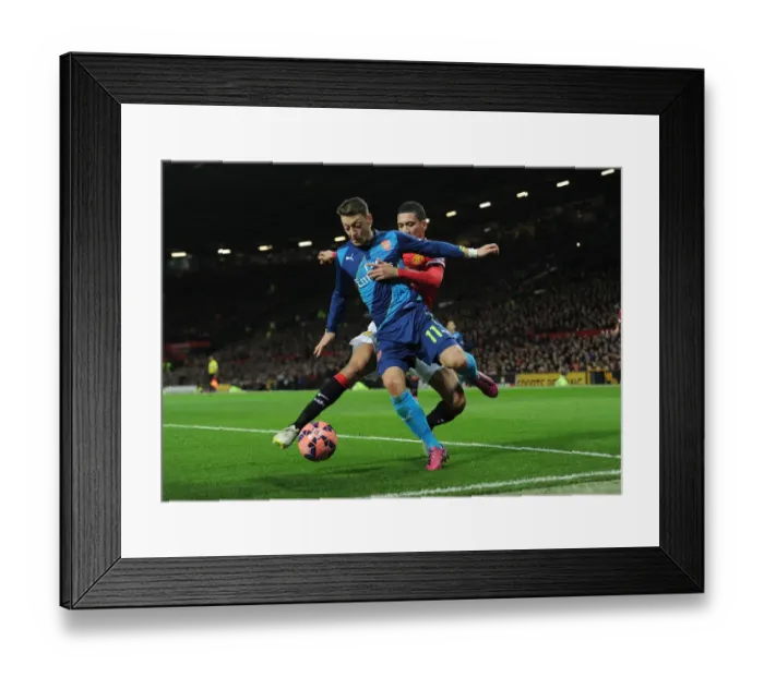 Framed Print : Clash of Titans: Ozil vs. Smalling - Manchester United vs. Arsenal FA Cup Quarterfinal Framed Print : Clash of Titans: Ozil vs. Smalling - Manchester United vs. Arsenal FA Cup Quarterfinal