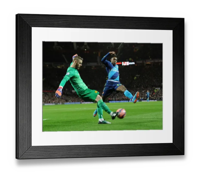 Framed Print : Danny Welbeck vs. David de Gea: Intense Battle in Manchester United vs. Arsenal FA Cup Quarterfinal