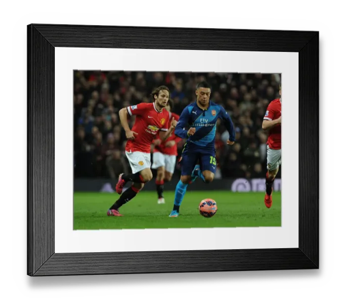 Framed Print : Arsenal's Oxlade-Chamberlain Tackles Manchester United's Blind in FA Cup Quarterfinal Showdown