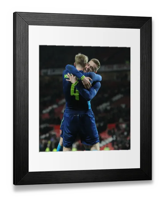 Framed Print : Arsenal's Glory: Mertesacker and Chambers Celebrate FA Cup Quarterfinal Victory over Manchester United Framed Print : Arsenal's Glory: Mertesacker and Chambers Celebrate FA Cup Quarterfinal Victory over Manchester United