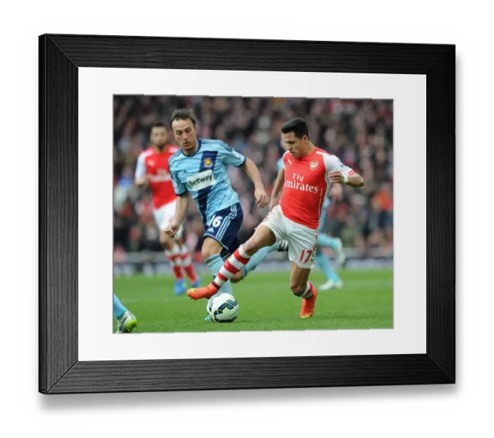 Framed Print : Clash of Stars: Sanchez vs. Noble in Arsenal's Battle against West Ham